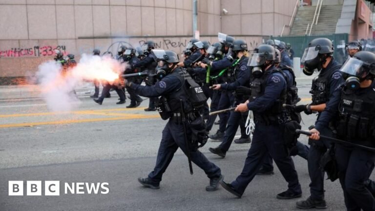 Riot police and protesters clash after LA immigration raids
